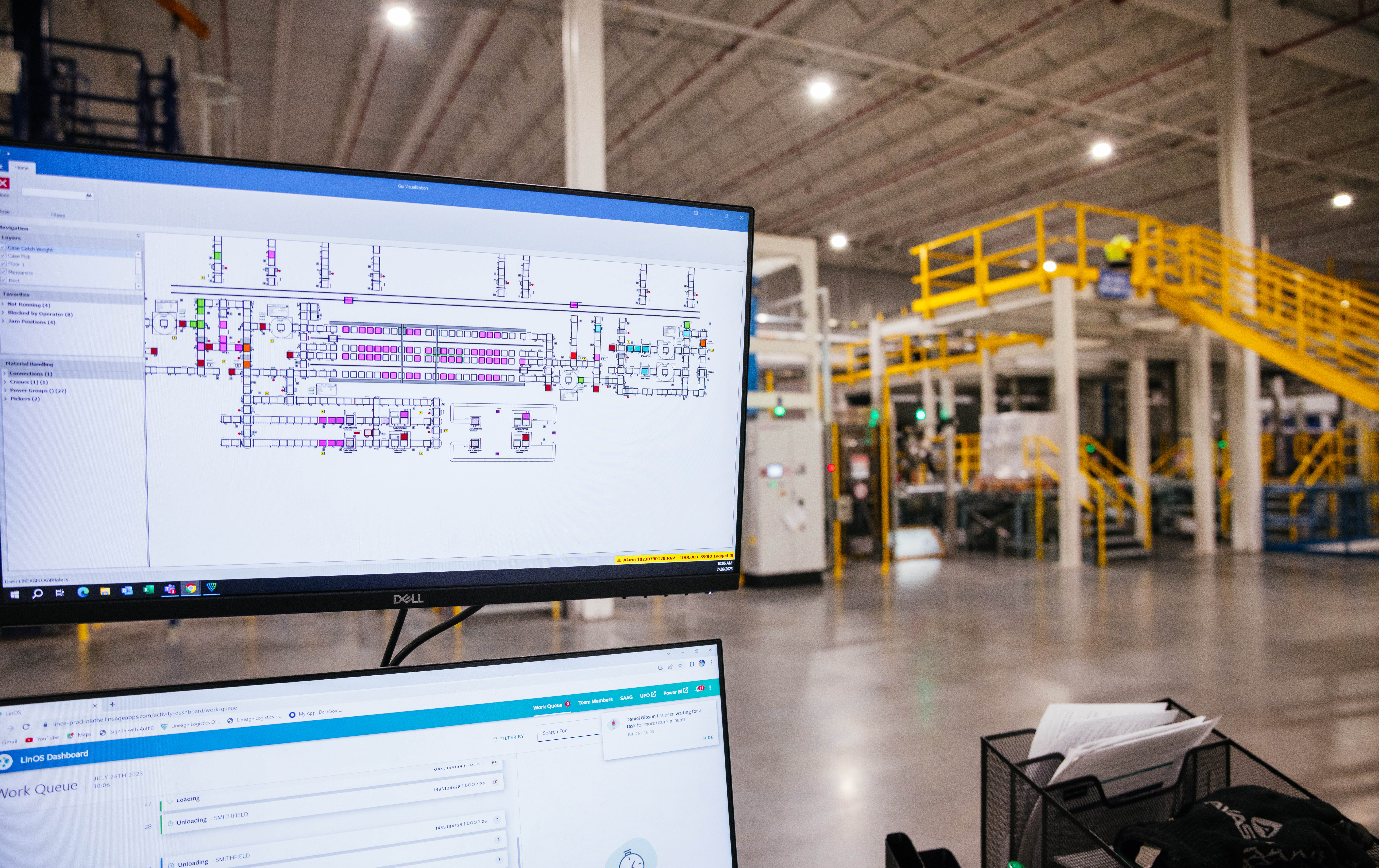 Two computer screens in a Airsun Express warehouse